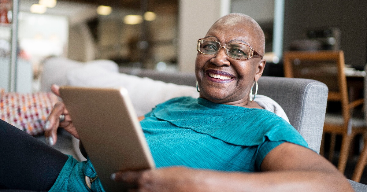 Portrait of a senior woman using tablet at home