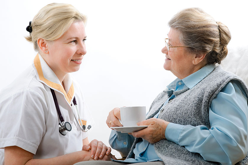 healthcare worker and senior woman