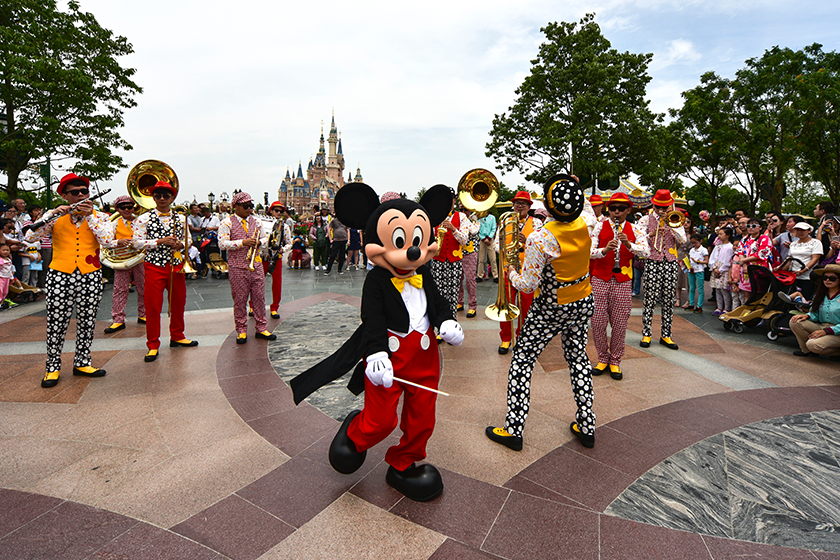 entertainer dressed mickey mouse costume performs parade first anniversary celebration