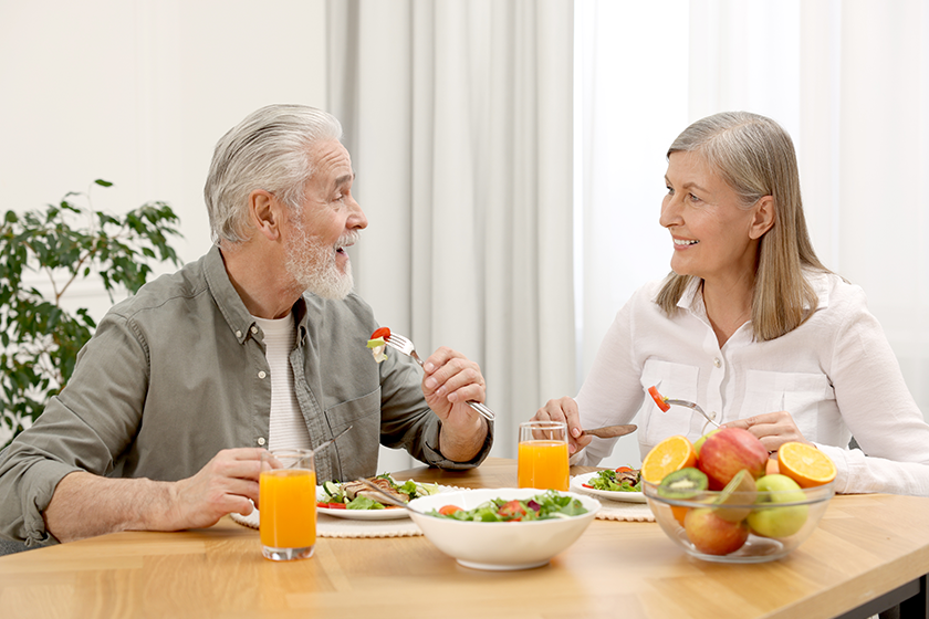 happy senior couple having dinner